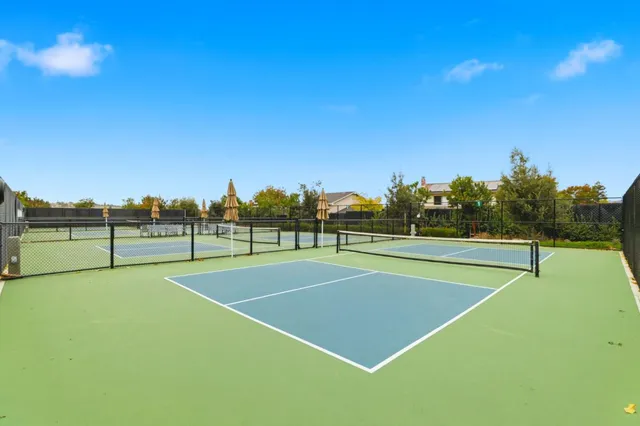 a view of swimming pool with a patio and a garden