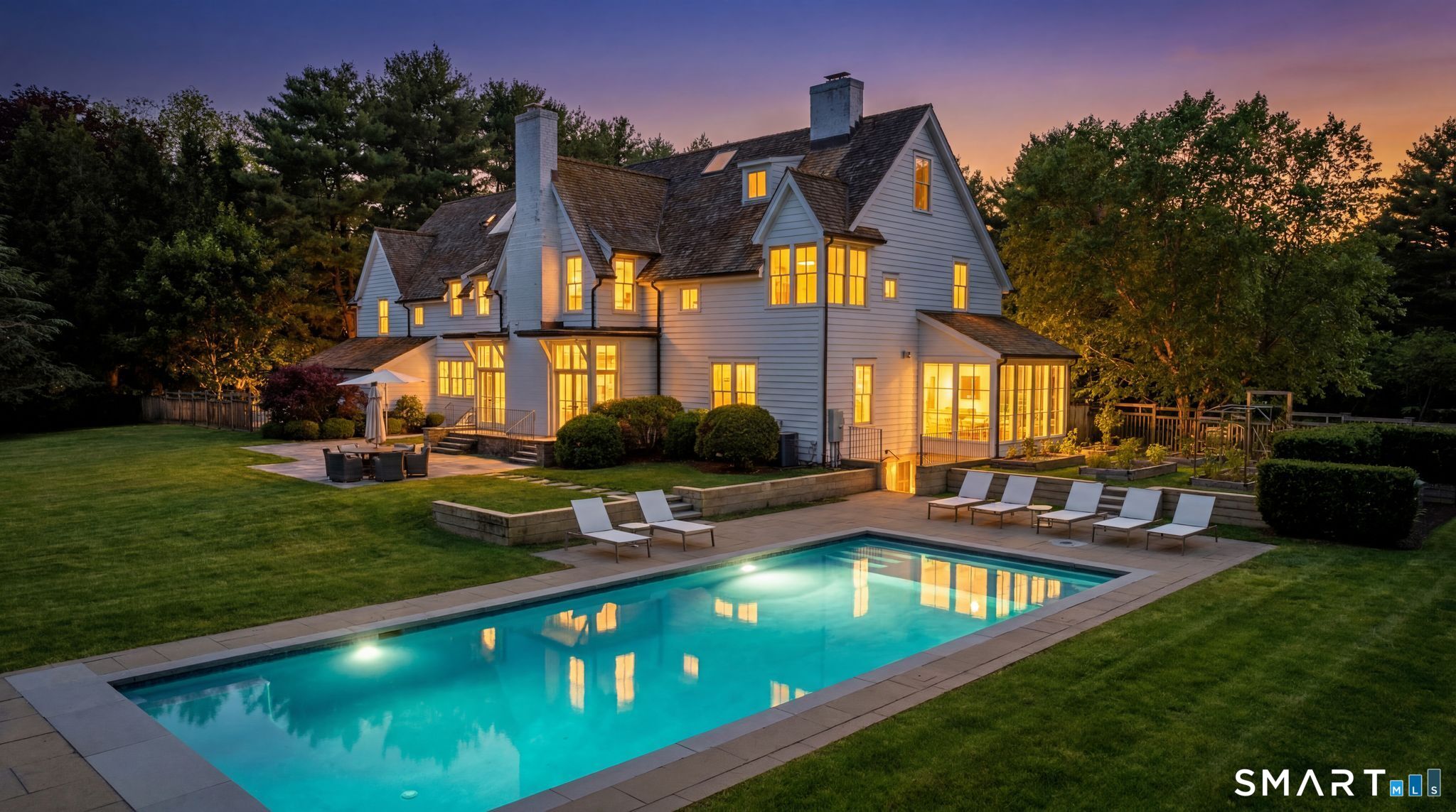 5 West Branch Road Weston, CT 06883 - Photo 5 of 40 a front view of a house with swimming pool having outdoor seating