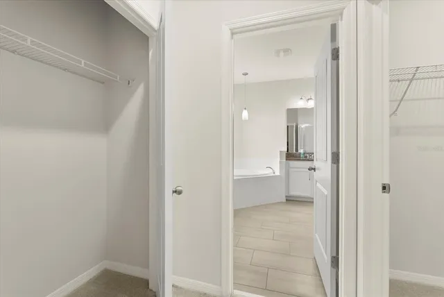 a bathroom with a granite countertop sink tub and a mirror