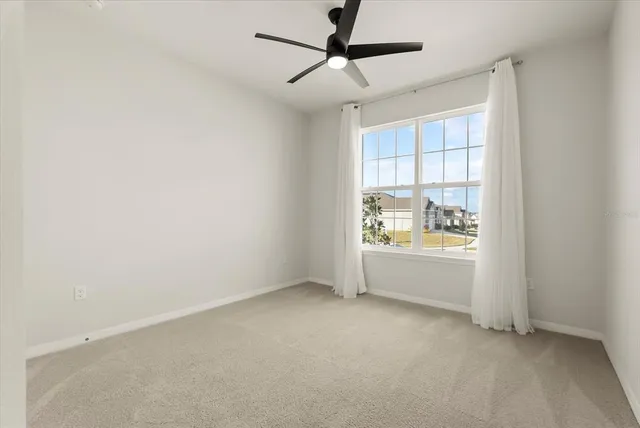 a view of an empty room and window