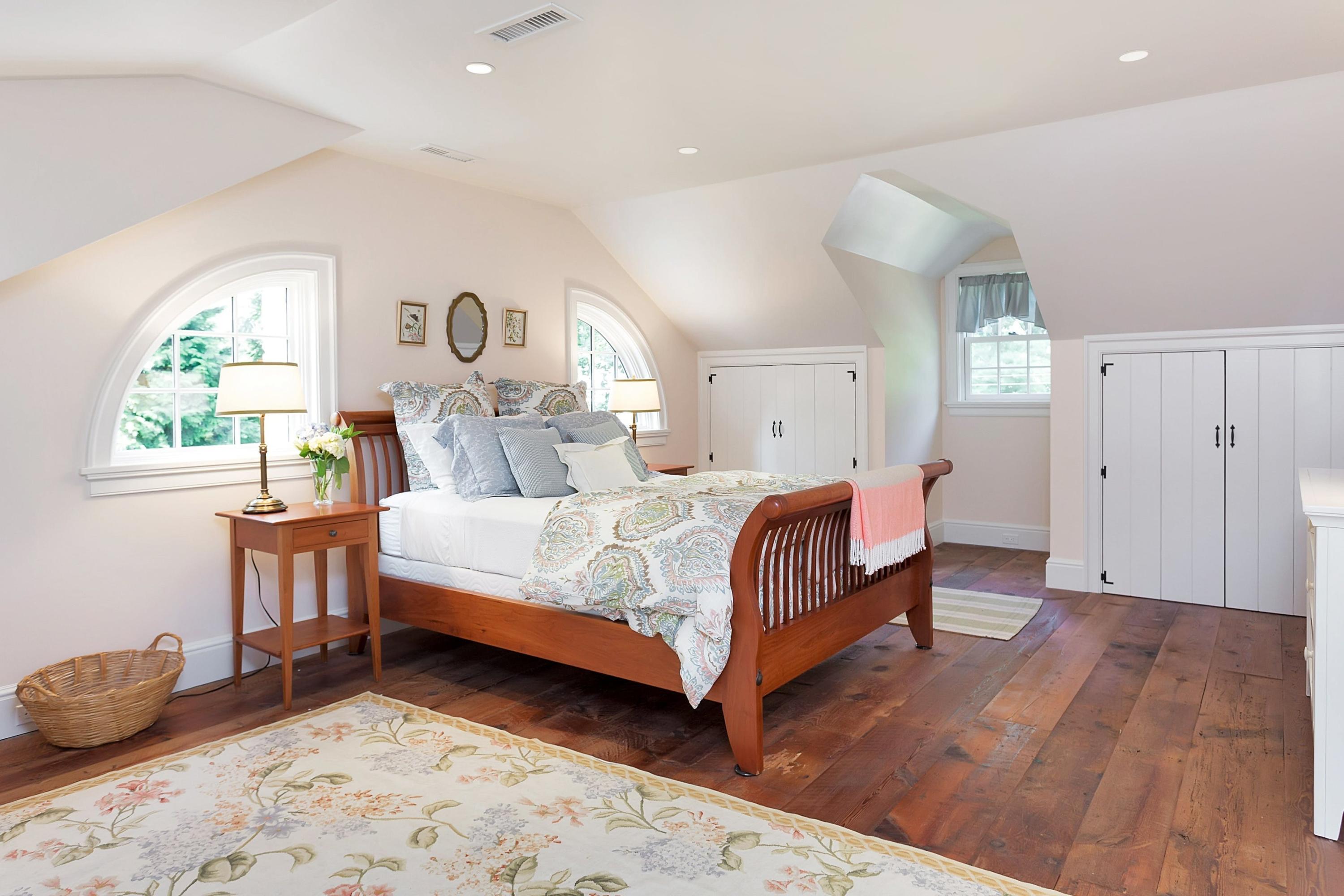 350 Hollow Tree Ridge Road Darien, CT 06820 - Photo 23 of 40 a bedroom with a bed and a window