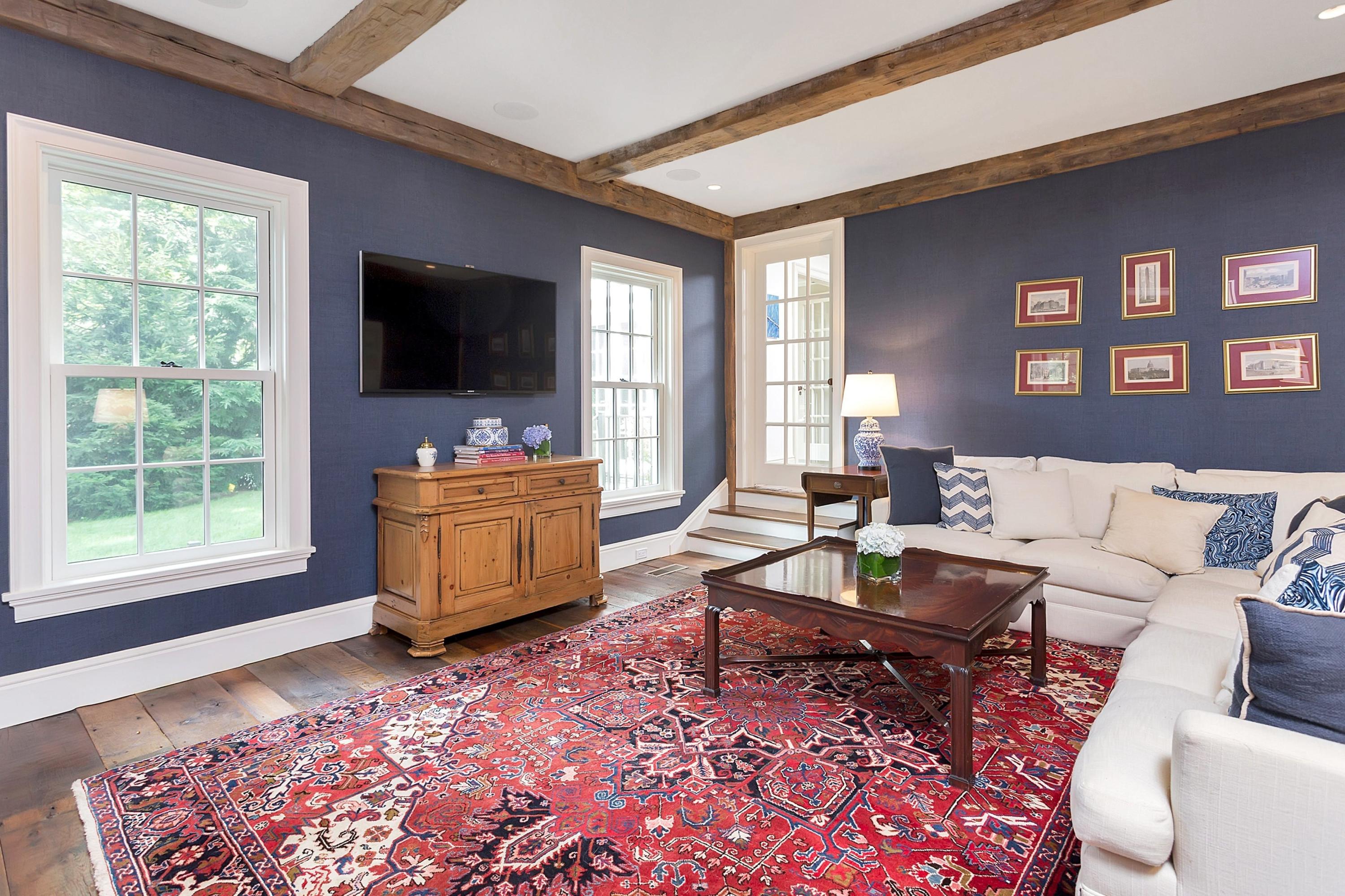 350 Hollow Tree Ridge Road Darien, CT 06820 - Photo 10 of 40 a living room with furniture and a flat screen tv