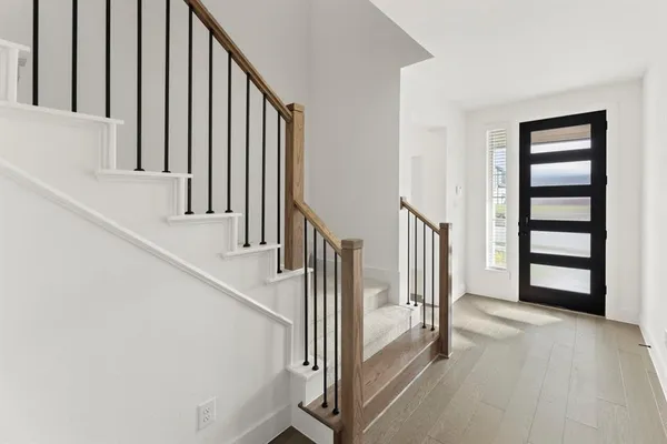 a view of a hallway with staircase