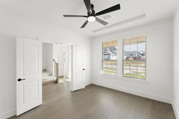 a view of an empty room with a window