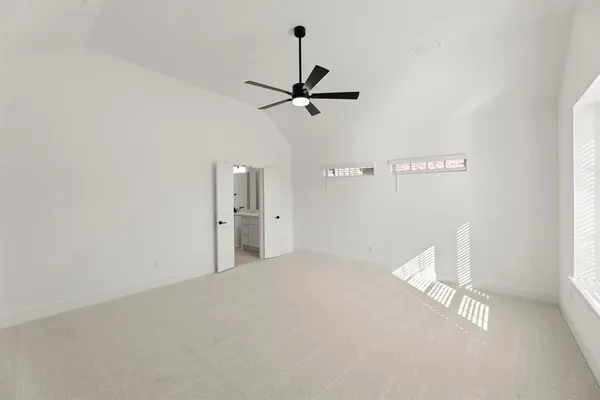 a view of a room with a ceiling fan