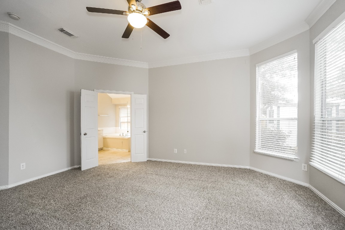 16042 Belleshire Lane Houston, TX 77084 - Photo 12 of 18 a view of an empty room with a window