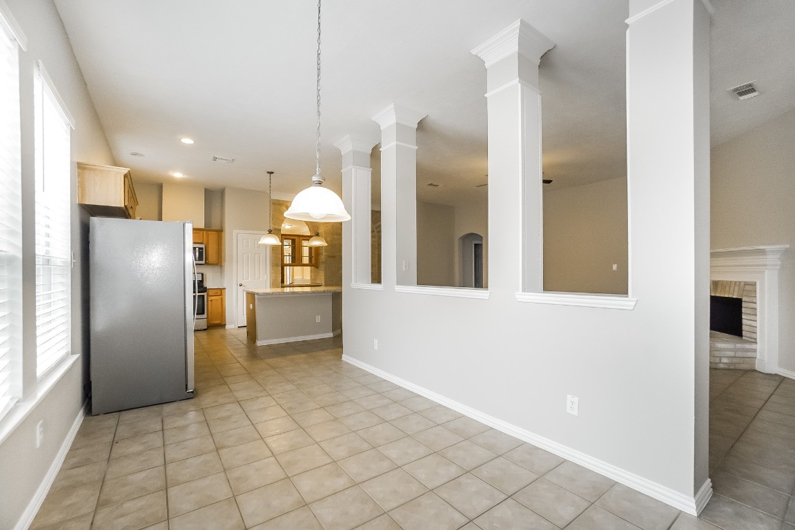 16042 Belleshire Lane Houston, TX 77084 - Photo 6 of 18 a view of a kitchen with furniture and stainless steel appliances
