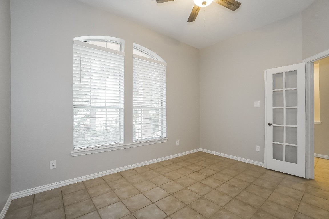 16042 Belleshire Lane Houston, TX 77084 - Photo 8 of 18 a view of an empty room with a window