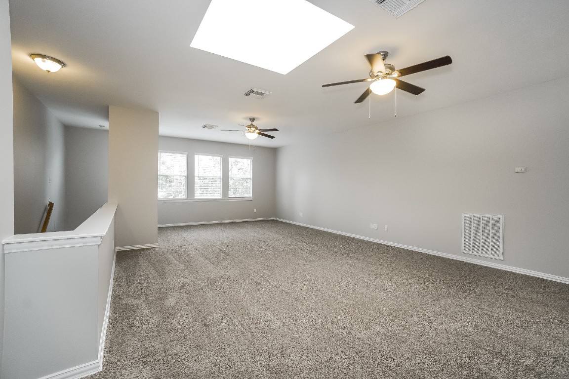 16042 Belleshire Lane Houston, TX 77084 - Photo 9 of 18 a view of an empty room with a window