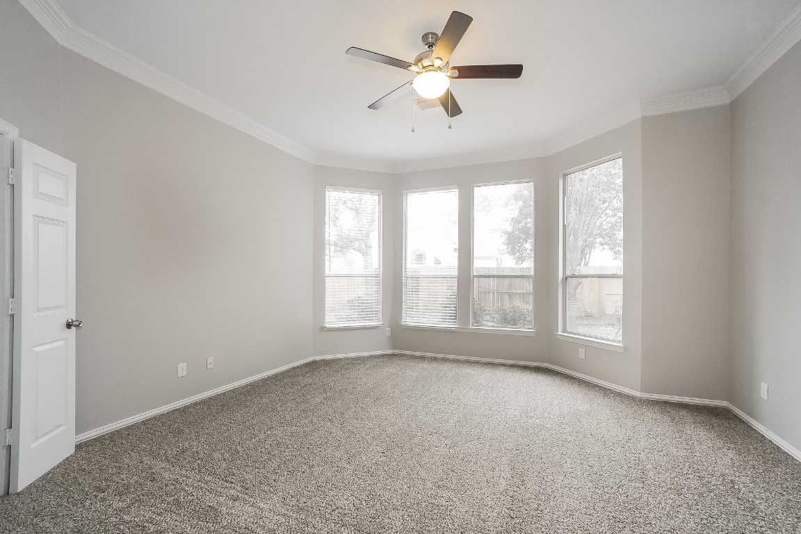 16042 Belleshire Lane Houston, TX 77084 - Photo 10 of 18 a view of an empty room with a window