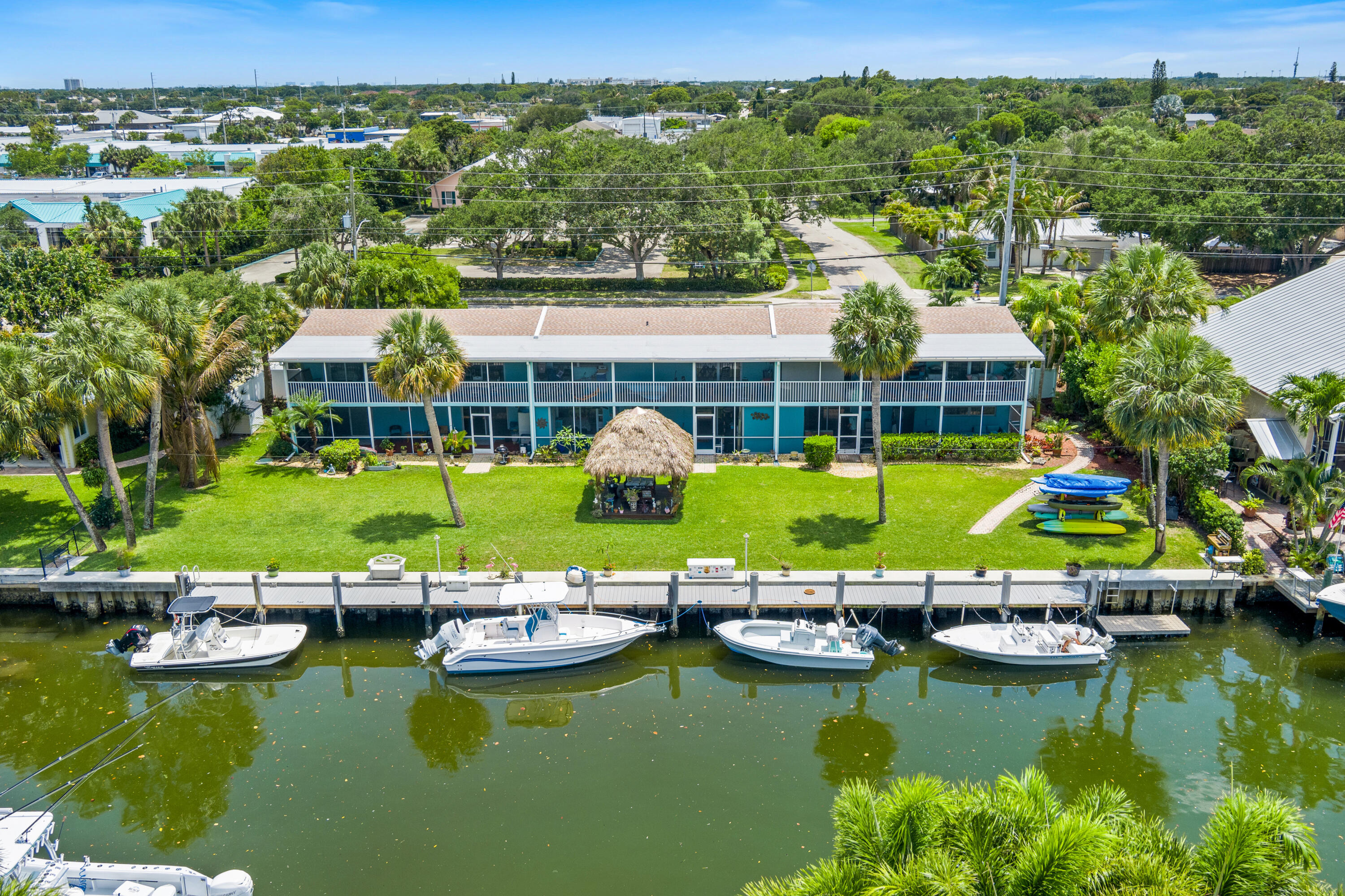 249 Center Street, Unit 2C Jupiter, FL 33458 - Photo 1 of 29 an aerial view of a house with a swimming pool yard and outdoor seating