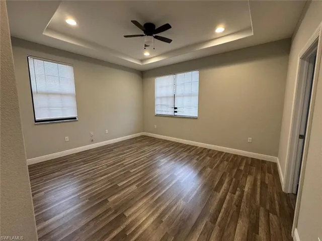 a view of kitchen with sink and refrigerator