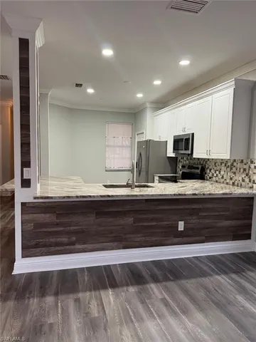 a bathroom with a sink a mirror and vanity