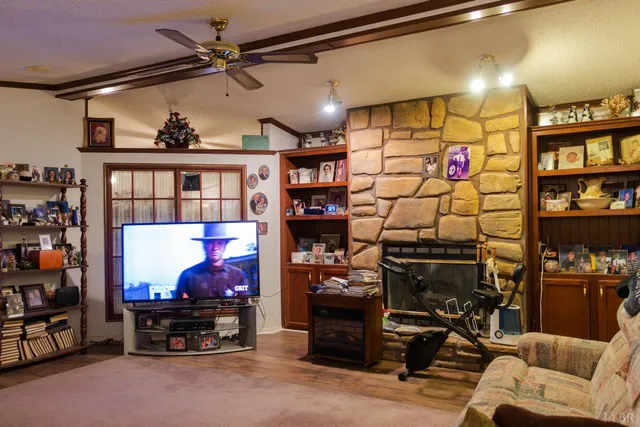 a kitchen with granite countertop a table chairs stove and cabinets