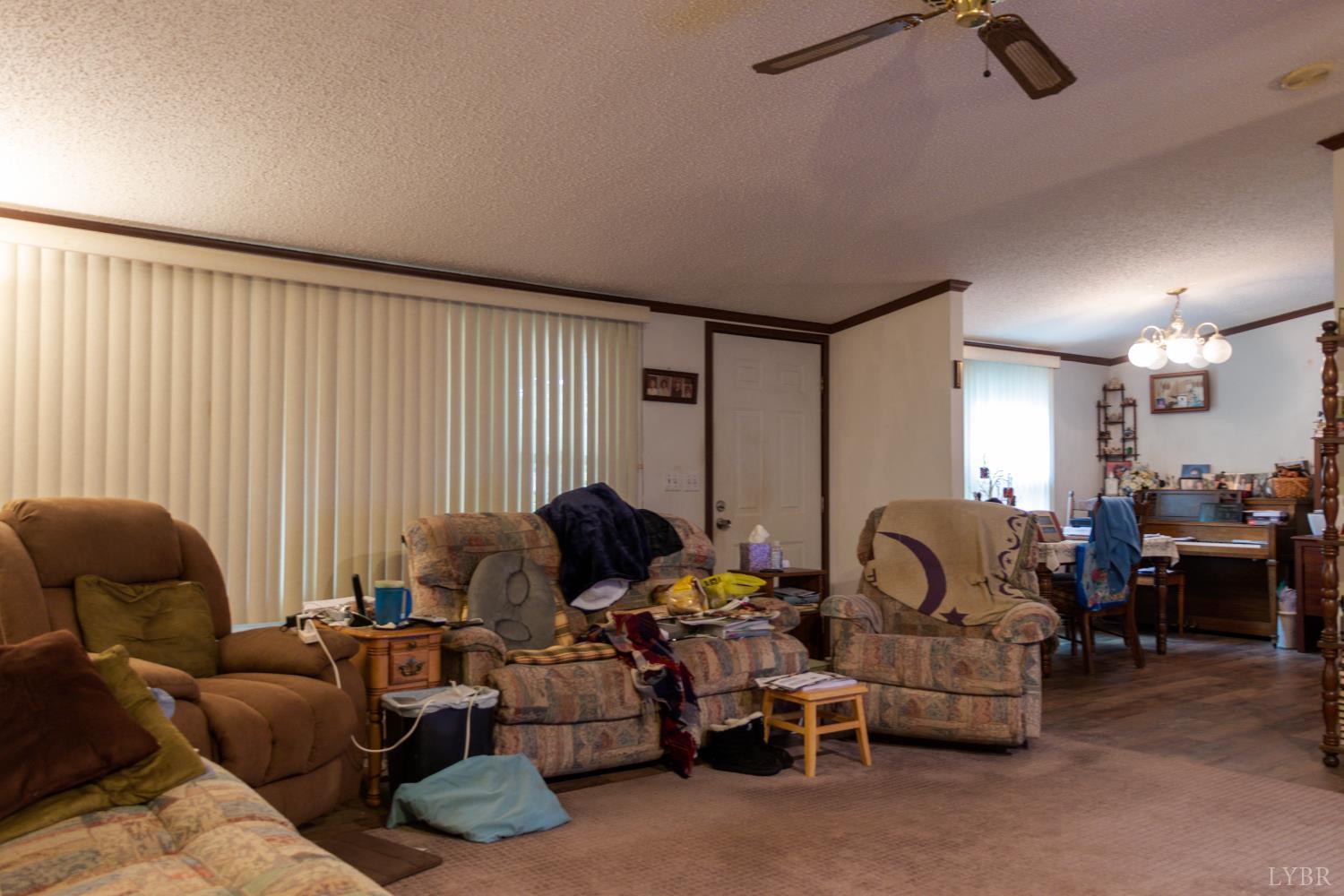 3160 Owens Mill Road Gretna, VA 24557 - Photo 13 of 59 a living room with furniture and a window