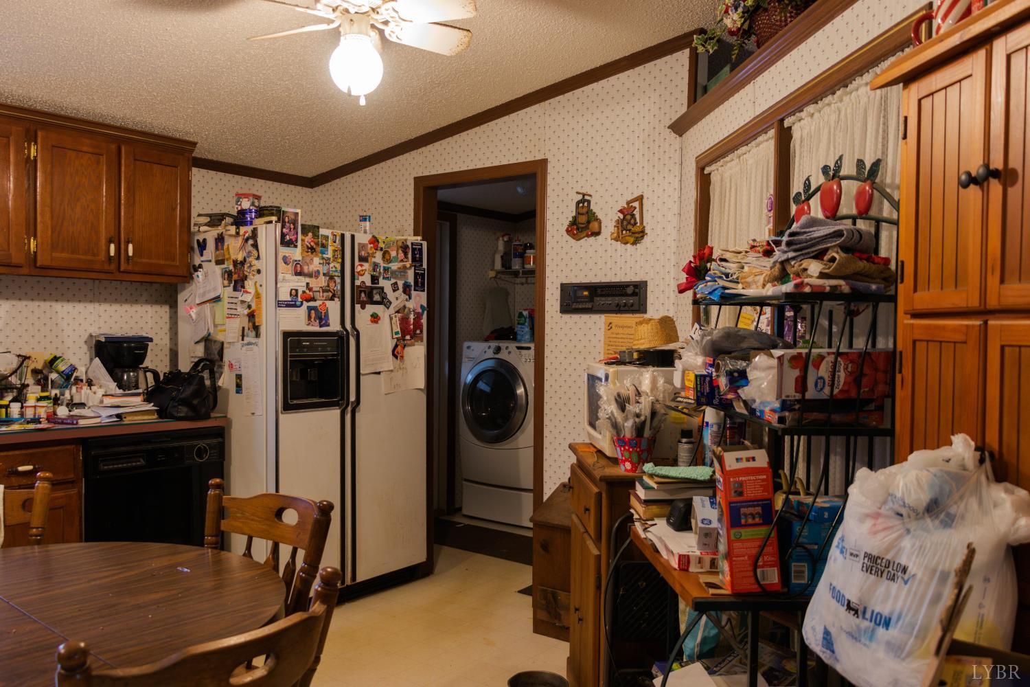3160 Owens Mill Road Gretna, VA 24557 - Photo 16 of 59 a view of a kitchen with fridge and workspace