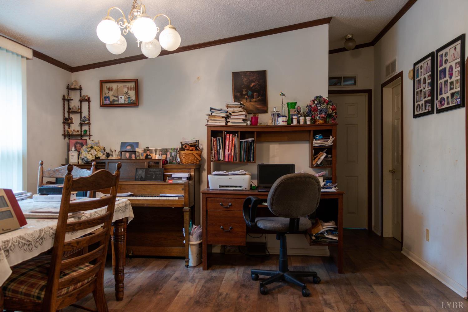 3160 Owens Mill Road Gretna, VA 24557 - Photo 17 of 59 a view of a workspace with furniture and a window