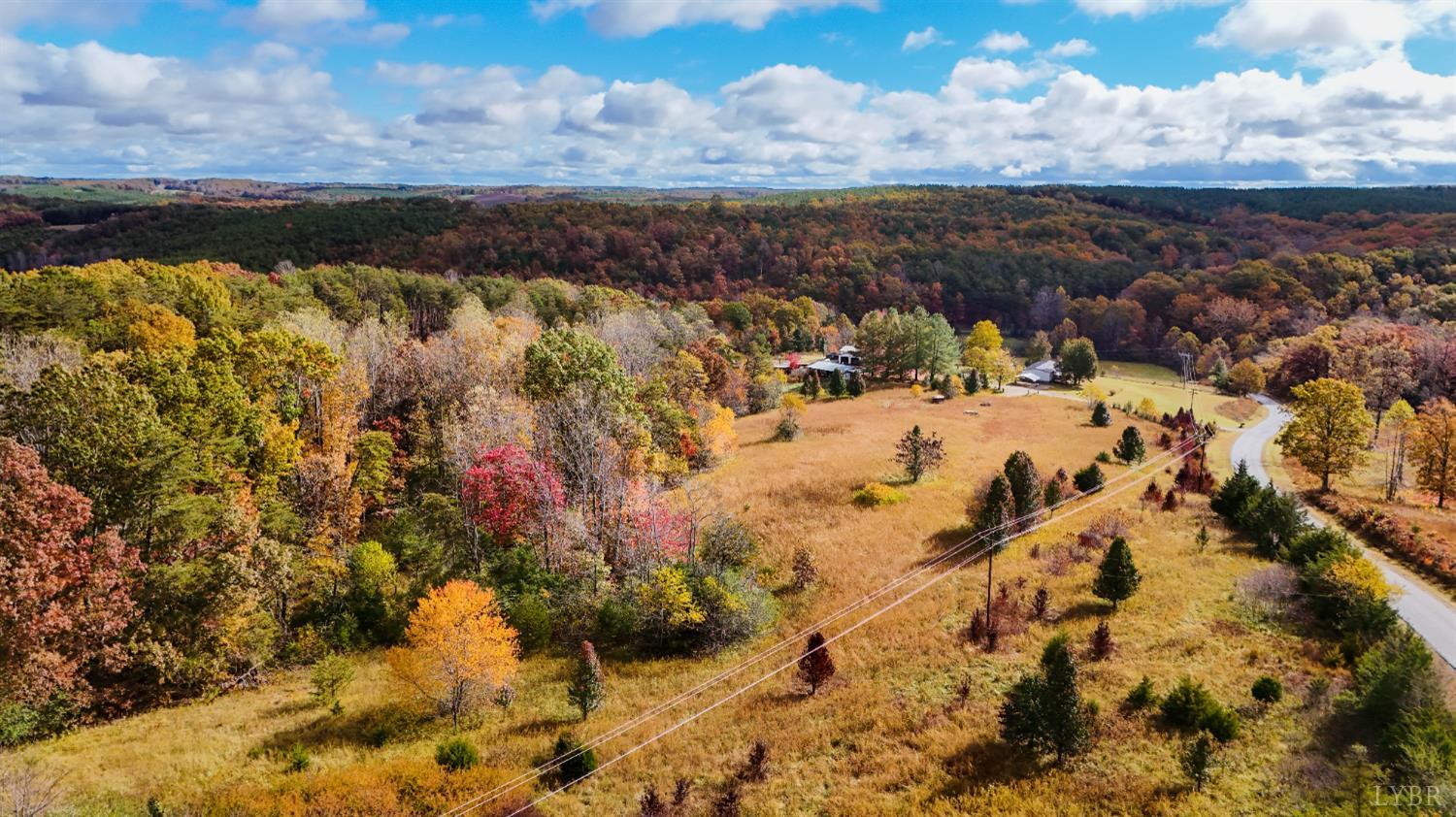 3160 Owens Mill Road Gretna, VA 24557 - Photo 2 of 59 a view of a lake with a building in the background