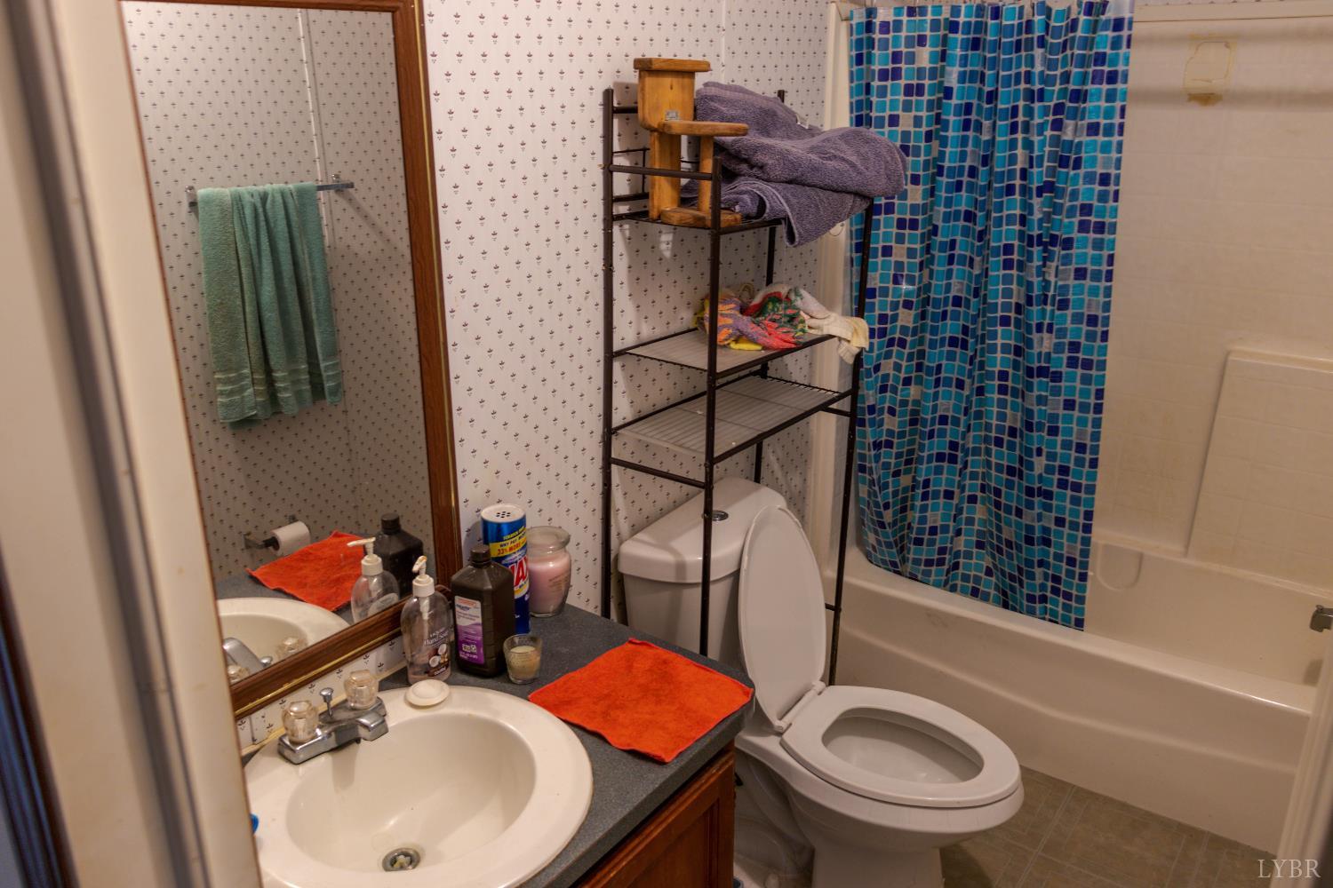 3160 Owens Mill Road Gretna, VA 24557 - Photo 28 of 59 a bathroom with a sink toilet and shower
