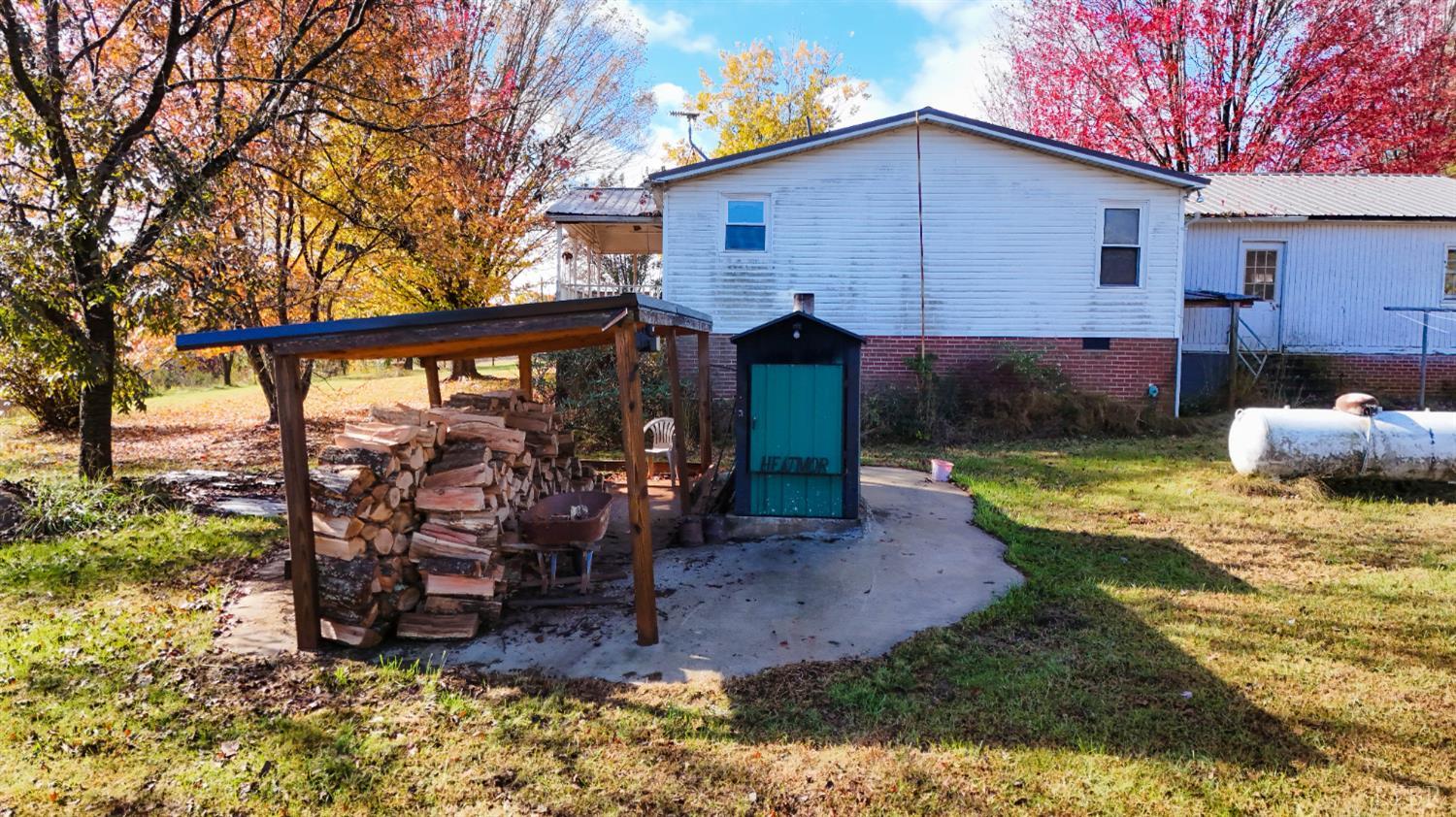 3160 Owens Mill Road Gretna, VA 24557 - Photo 35 of 59 a view of a house with backyard and chairs