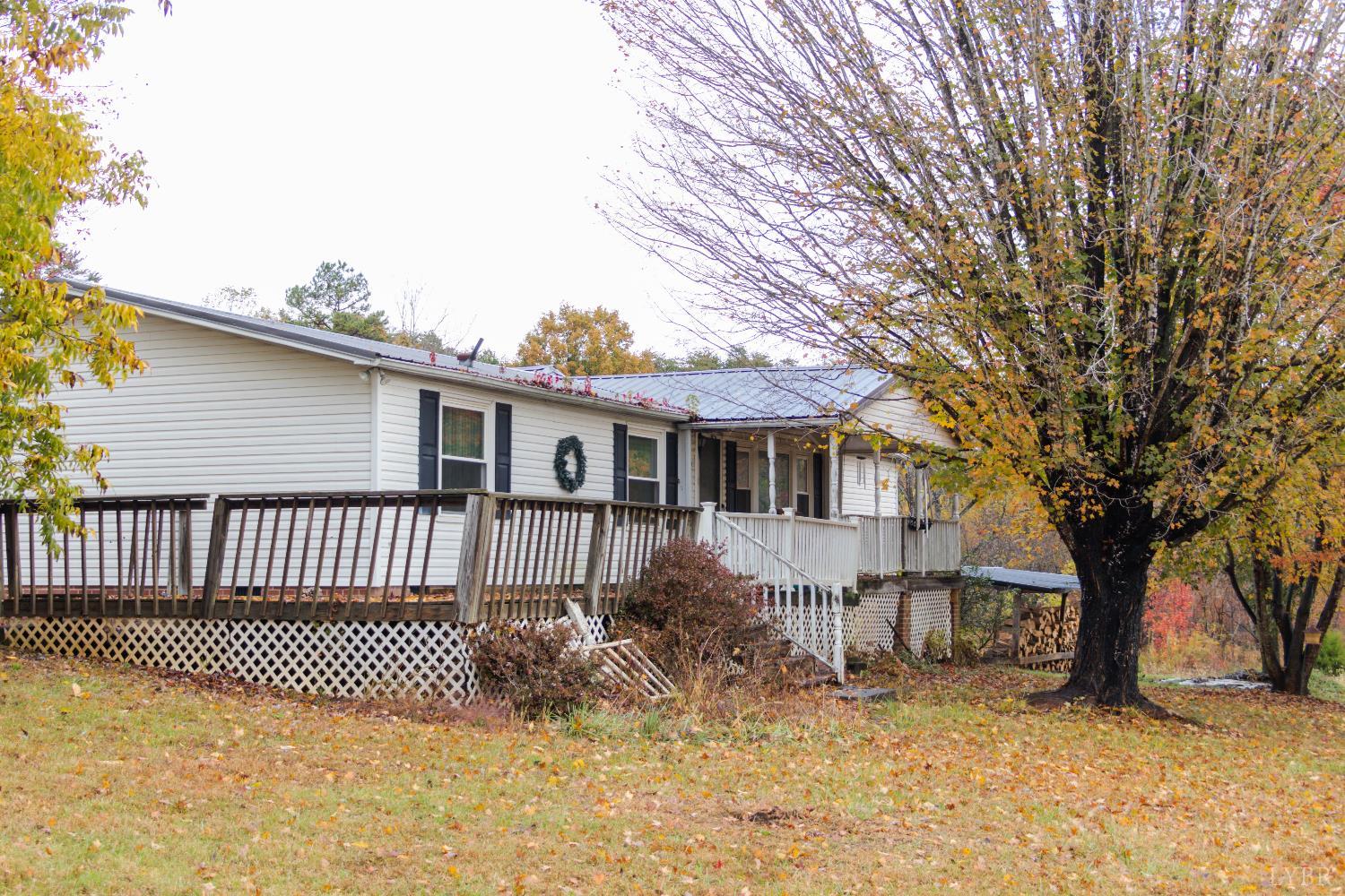 3160 Owens Mill Road Gretna, VA 24557 - Photo 47 of 59 a view of a house with a large tree and a yard