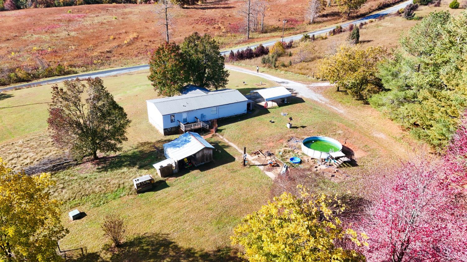 3160 Owens Mill Road Gretna, VA 24557 - Photo 50 of 59 an aerial view of a house with a yard and wooden fence