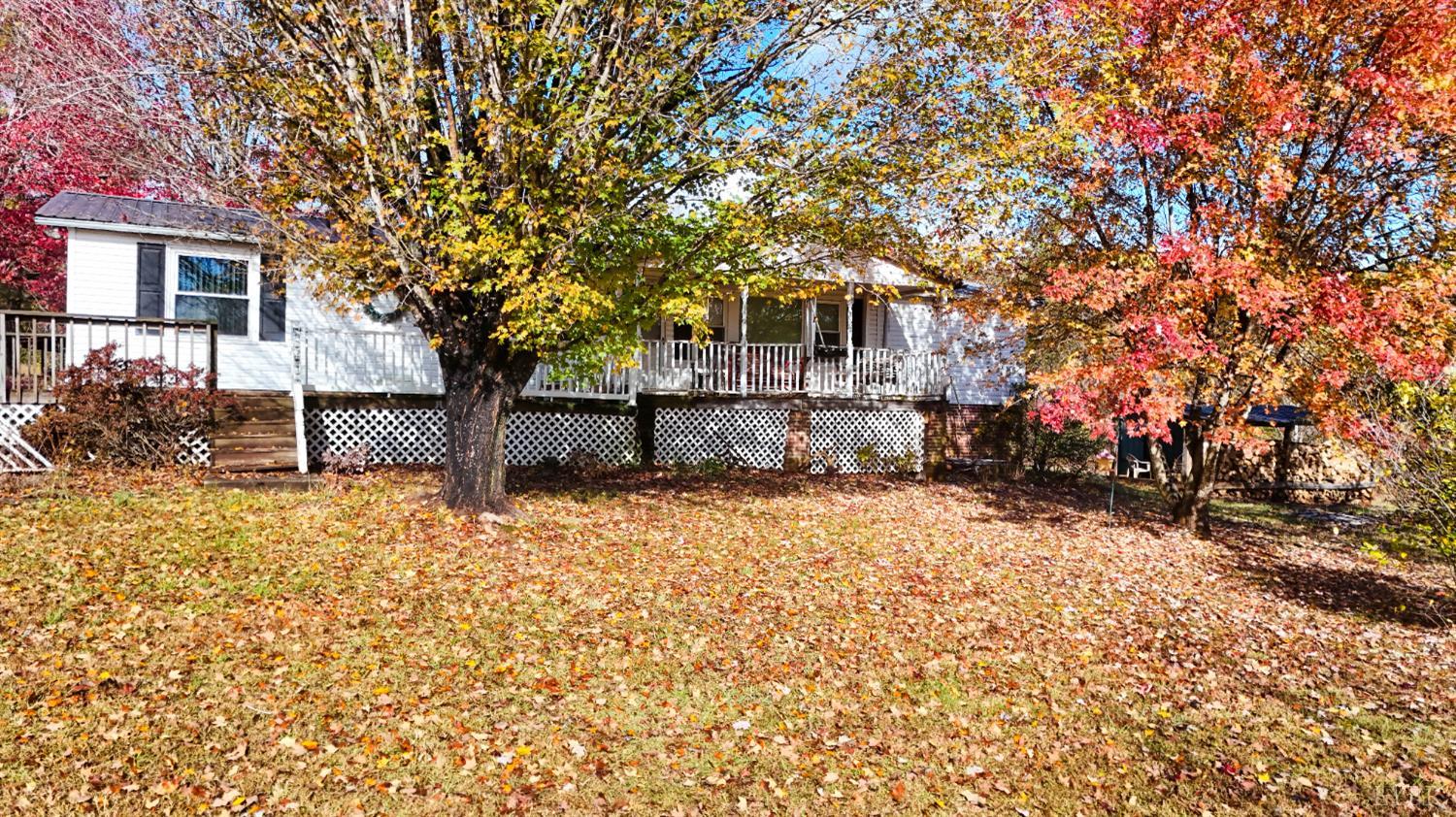 3160 Owens Mill Road Gretna, VA 24557 - Photo 6 of 59 front view of a house with a large tree