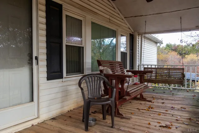 a view of a chairs and table in the balcony