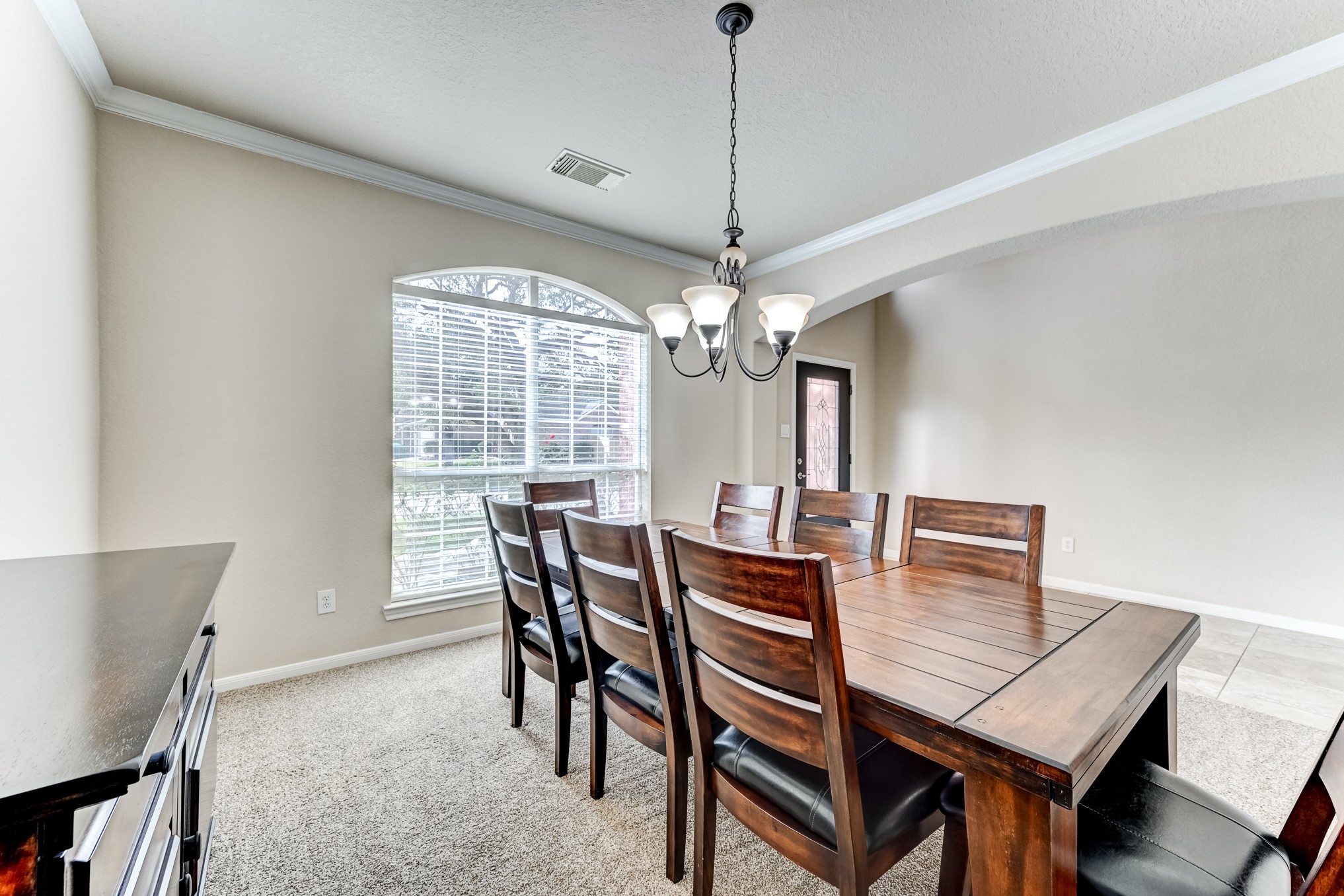 19502 Valkyrie Drive Spring, TX 77379 - Photo 11 of 49 a view of a dining room with furniture window and wooden floor