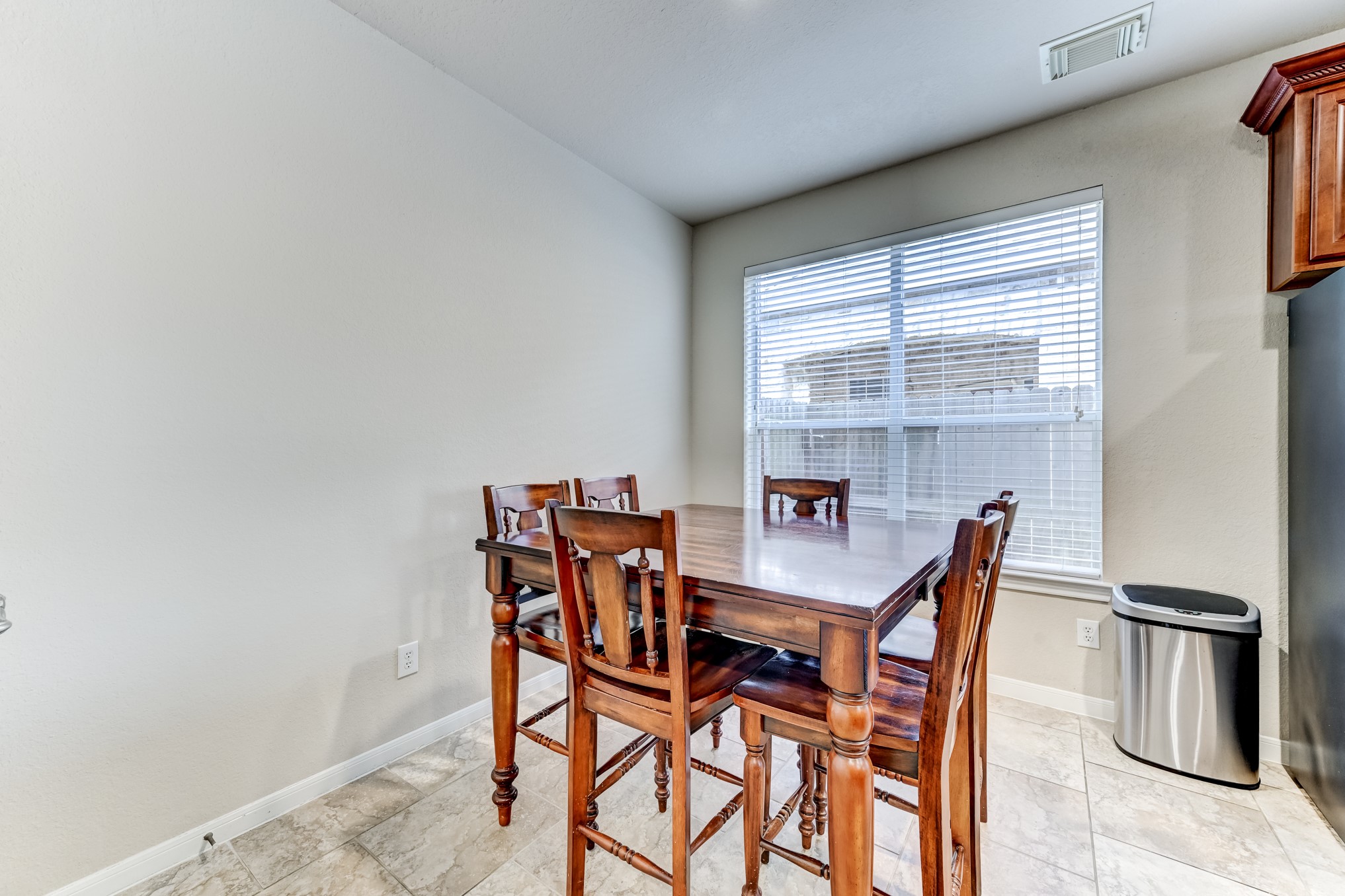 19502 Valkyrie Drive Spring, TX 77379 - Photo 20 of 49 a view of a dining room with furniture and a window