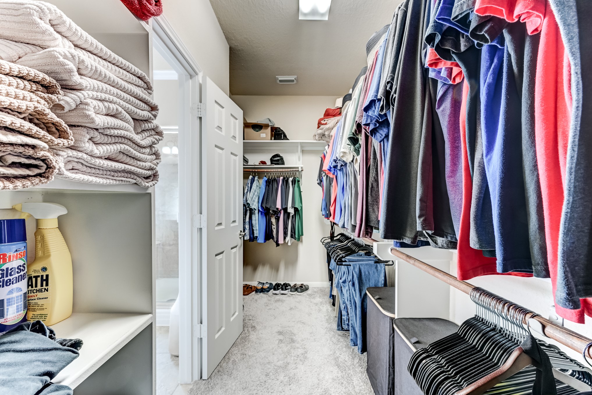 19502 Valkyrie Drive Spring, TX 77379 - Photo 28 of 49 a view of walk in closet with clothes and shoes