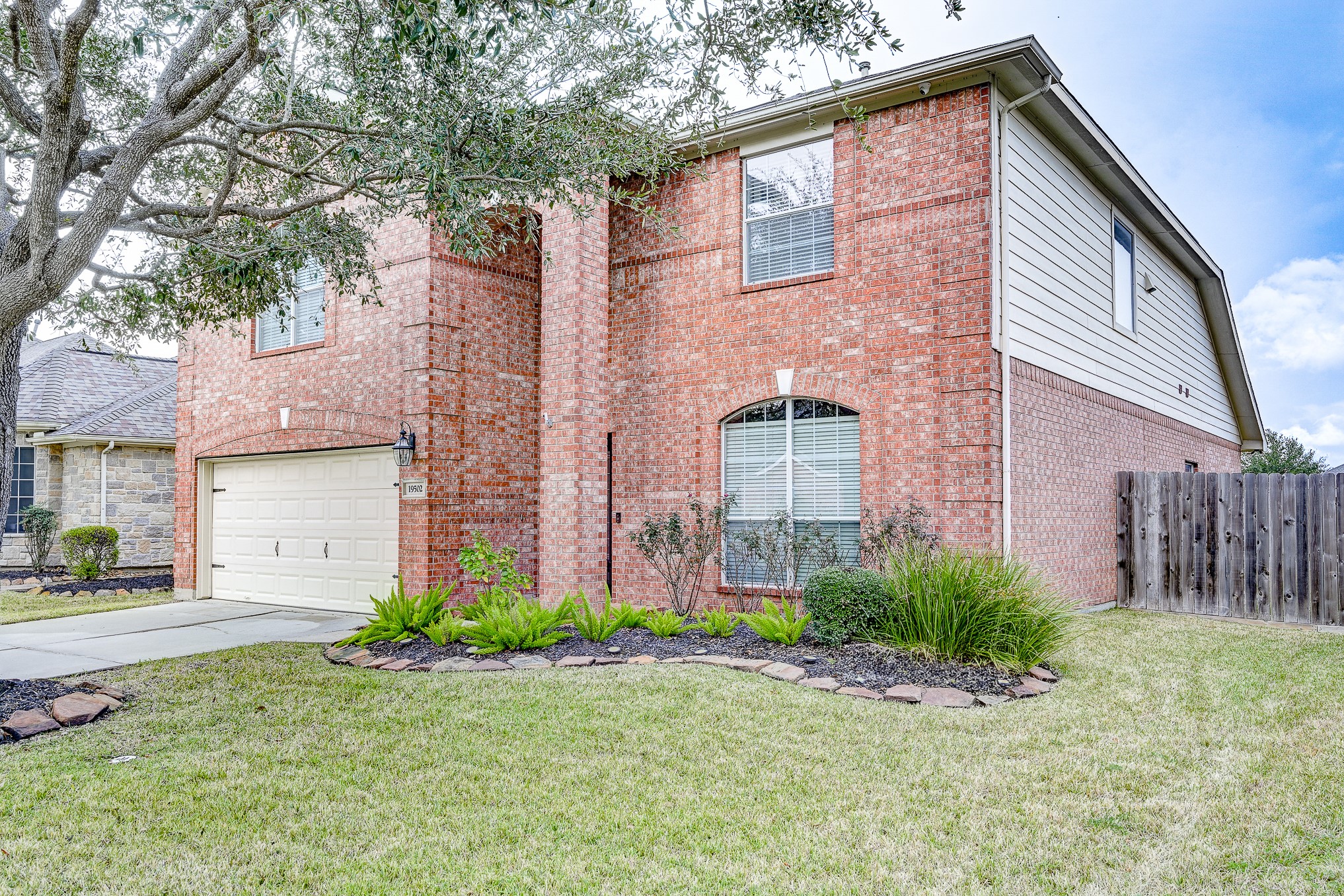19502 Valkyrie Drive Spring, TX 77379 - Photo 3 of 49 a front view of a house with garden