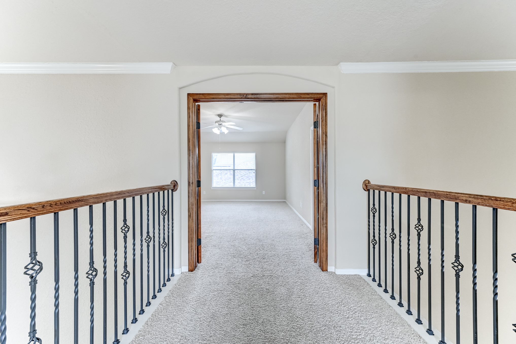 19502 Valkyrie Drive Spring, TX 77379 - Photo 31 of 49 a view of a hallway with wooden floor and a hallway