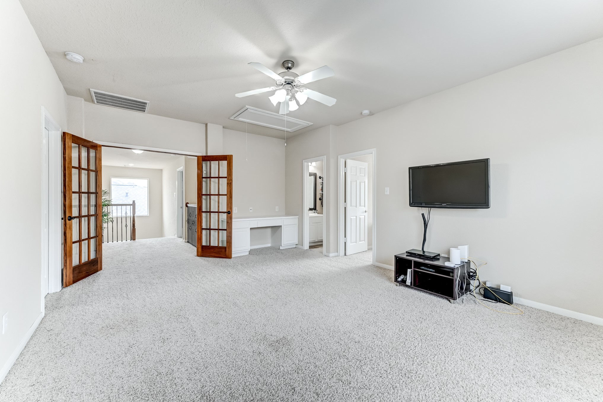 19502 Valkyrie Drive Spring, TX 77379 - Photo 35 of 49 a view of a livingroom with a flat screen tv