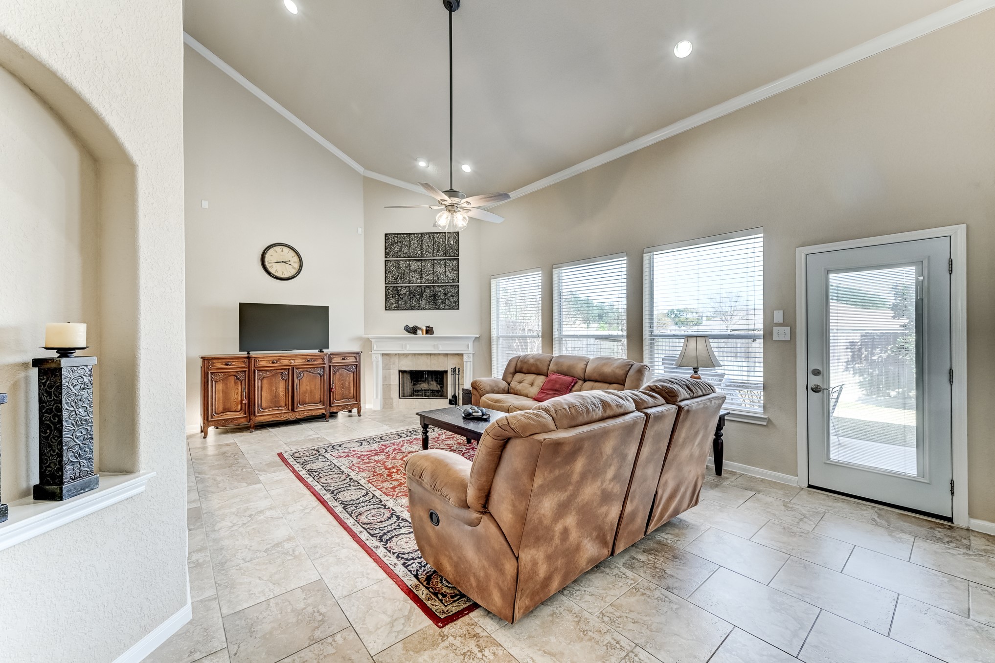 19502 Valkyrie Drive Spring, TX 77379 - Photo 7 of 49 a living room with furniture large window and a flat screen tv