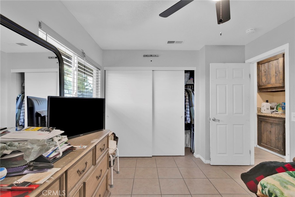 18608 Cocqui Road Apple Valley, CA 92307 - Photo 12 of 30 a living room with furniture and a flat screen tv