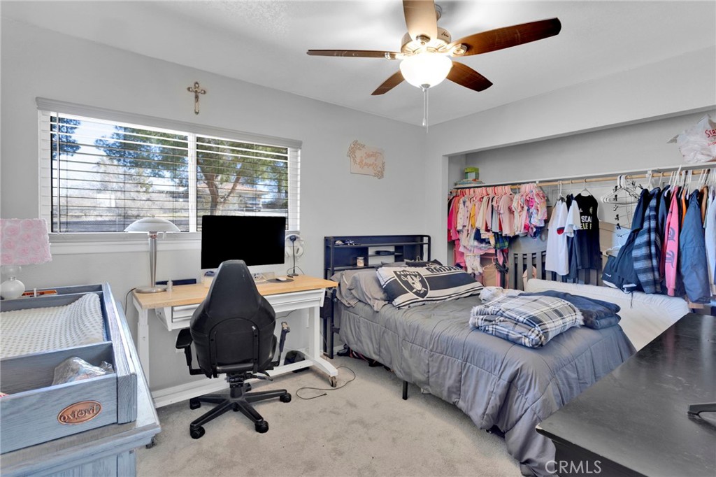 18608 Cocqui Road Apple Valley, CA 92307 - Photo 15 of 30 a view of a livingroom with workspace and a window