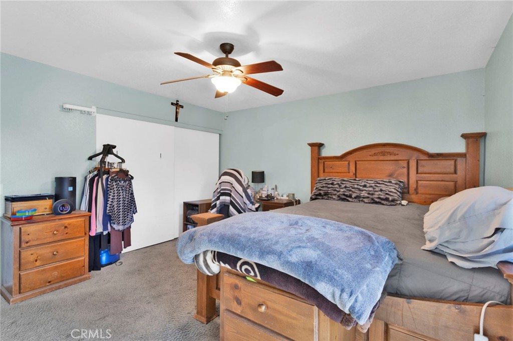 18608 Cocqui Road Apple Valley, CA 92307 - Photo 16 of 30 a bedroom with a bed and a closet