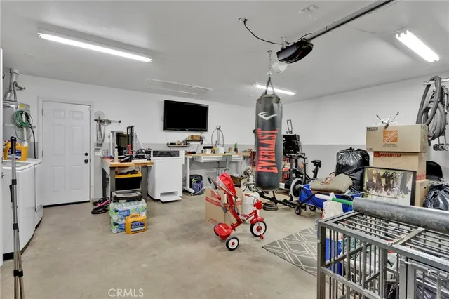 a storage room with lots of furniture and white walls