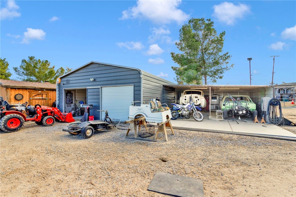 18608 Cocqui Road Apple Valley, CA 92307 - Photo 22 of 30 a view of the patio with a table and chairs