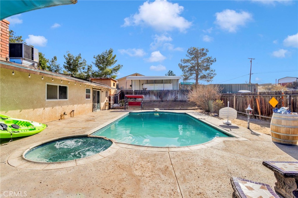 18608 Cocqui Road Apple Valley, CA 92307 - Photo 25 of 30 a swimming pool with outdoor seating and yard