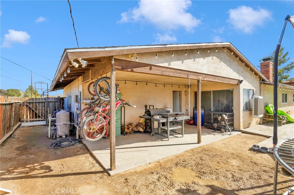 18608 Cocqui Road Apple Valley, CA 92307 - Photo 27 of 30 a view of a patio with table and chairs