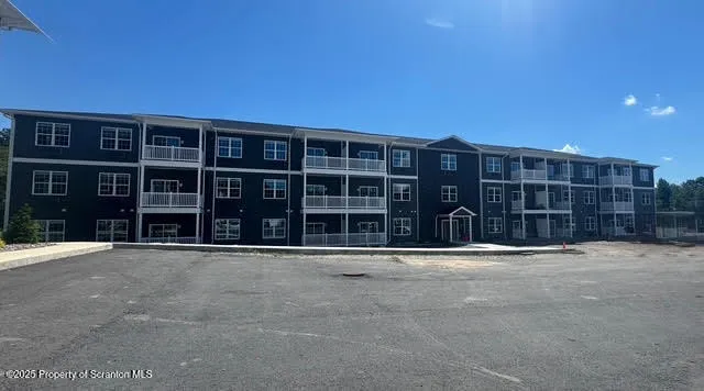 a front view of residential houses with yard