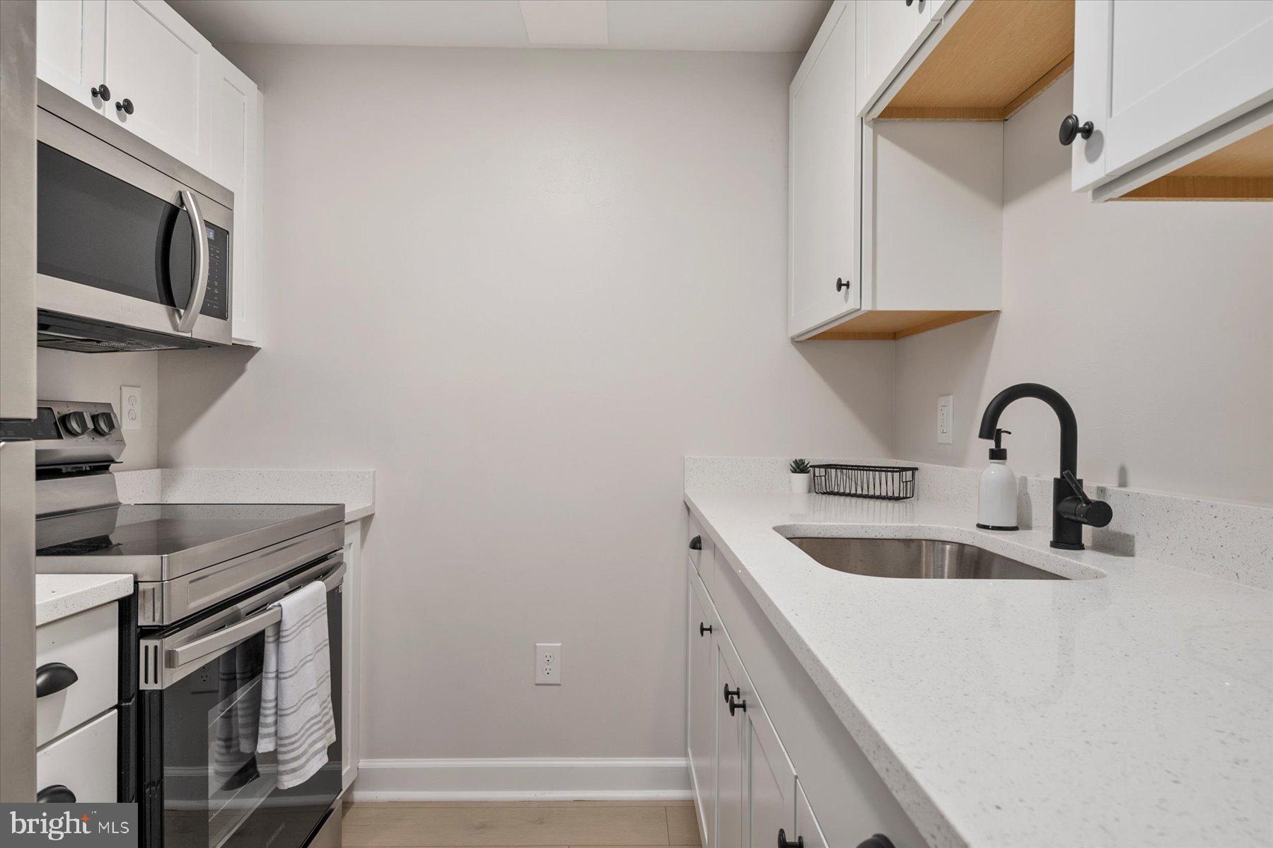 1683 Paris Oaks Road Owings, MD 20736 - Photo 49 of 59 New appliances and sparkling white quartz