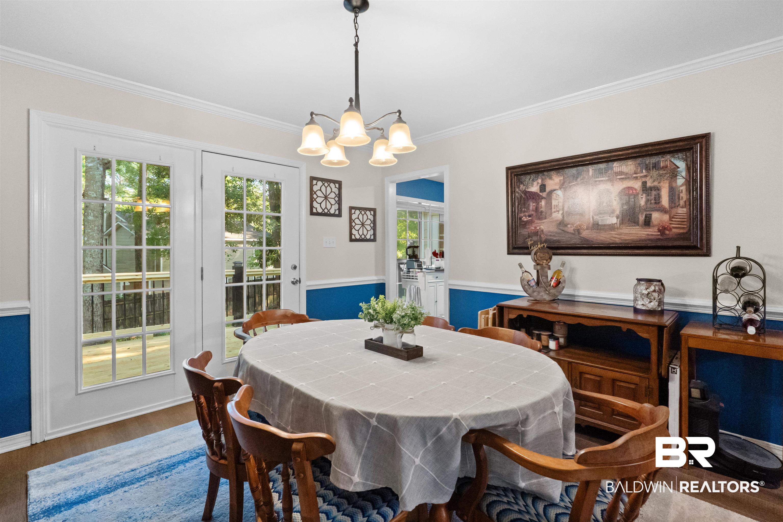 153 Lakeview Loop Daphne, AL 36526 - Photo 18 of 56 Large windows and a cheerful atmosphere create a setting where meals and memories are equally at home.