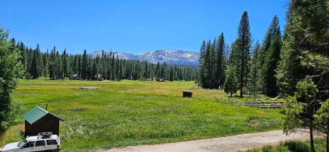 a view of a golf course with a house