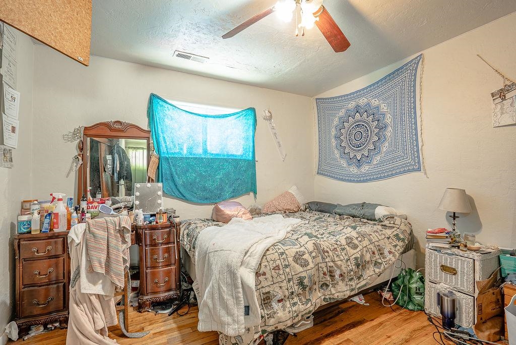 470 Riverside Avenue Chester, CA 96020 - Photo 12 of 25 a bedroom with a bed a couch and dresser