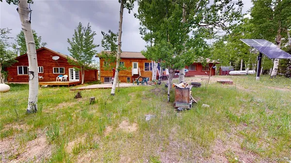 a view of a house with a yard porch and sitting area