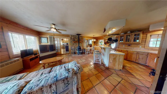 a living room with lots of furniture and a flat screen tv