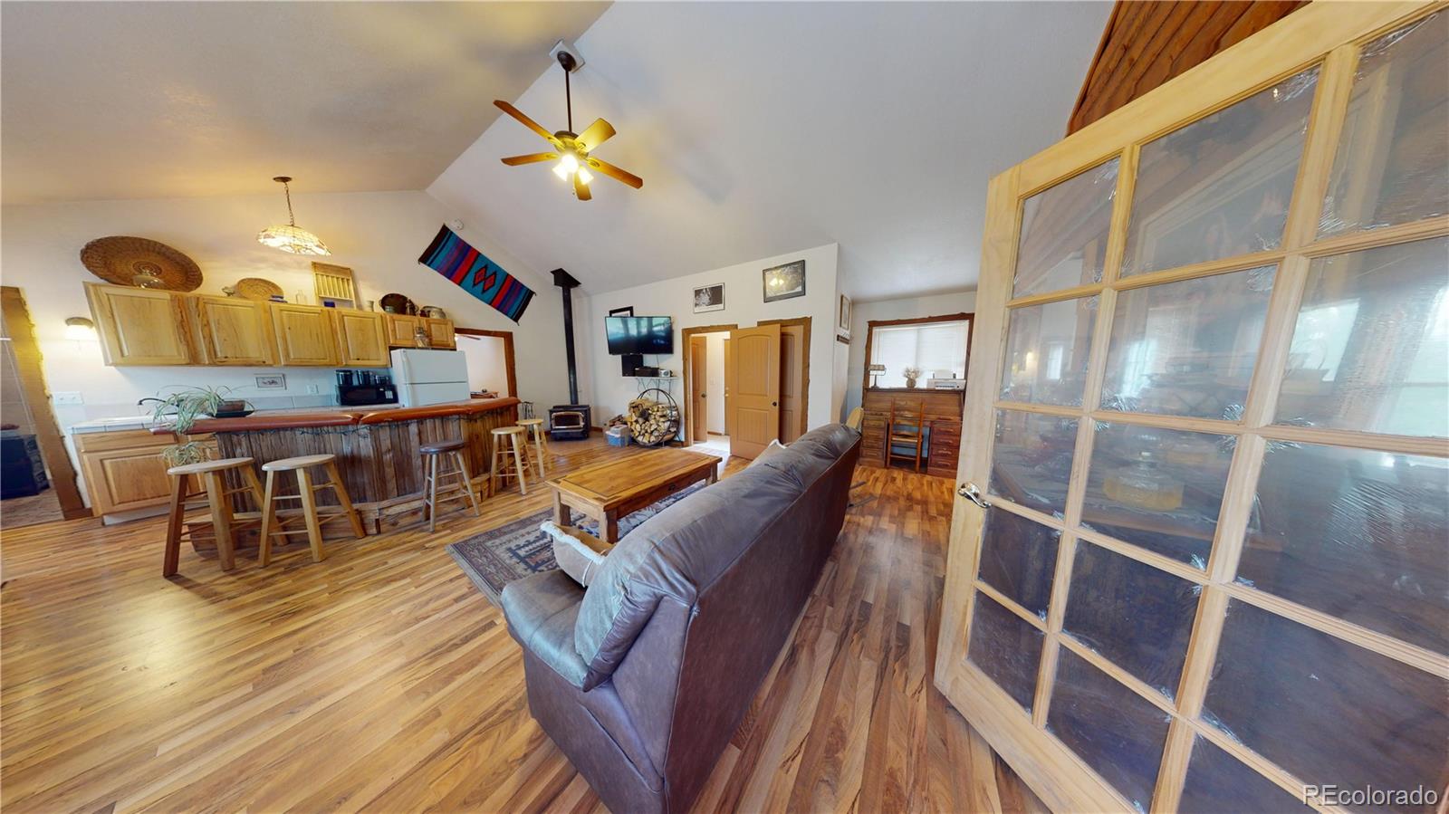 1011 Castle Ridge View Cripple Creek, CO 80813 - Photo 7 of 40 a living room with furniture and wooden floor